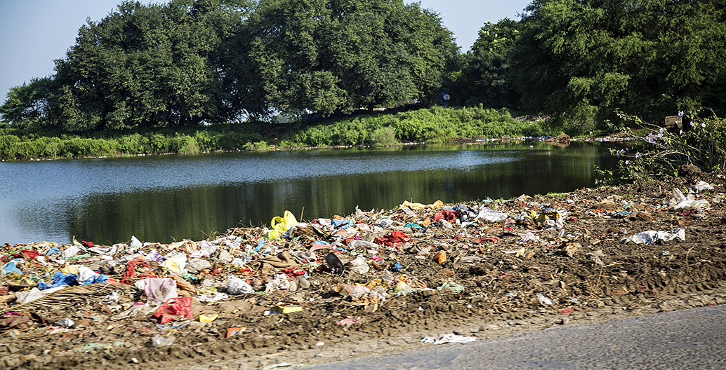 Rubbish laden rivers conspires with depleted groundwater to form a health disaster. Image courtesy John Hoey