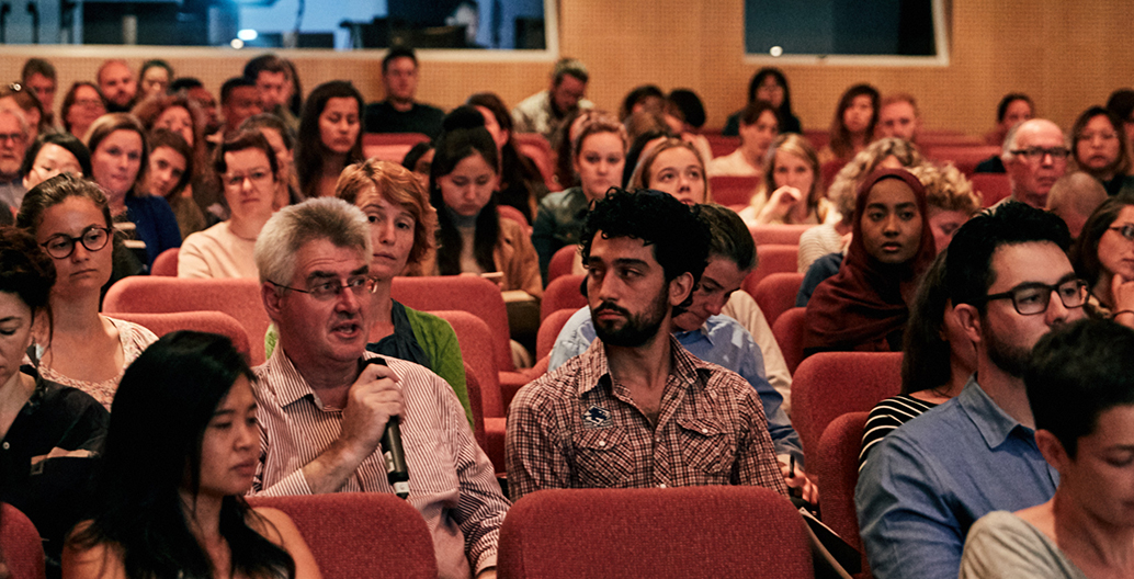 An audience member at the Urban Ecology forum poses a question to the panel.