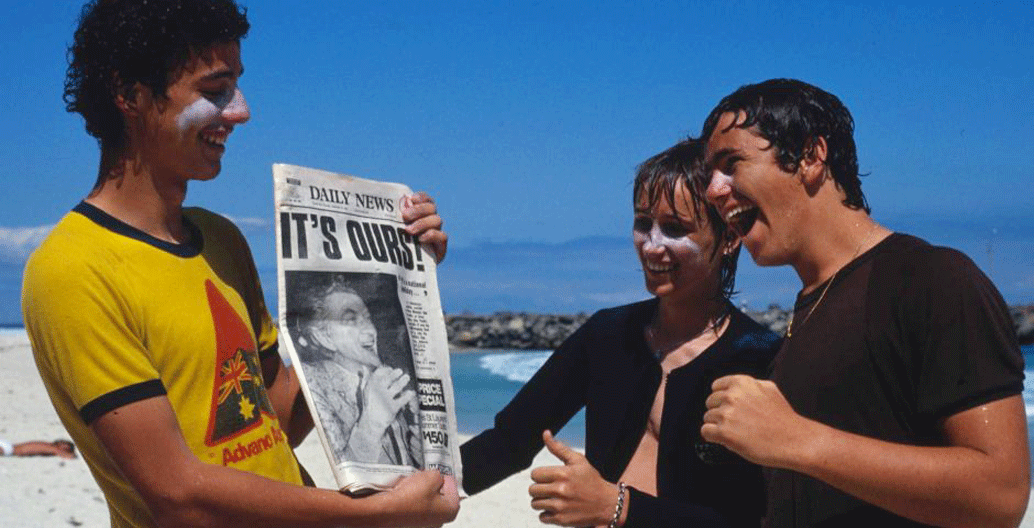 Perth residents celebrate after waking to the news Australia had won the America's Cup. Image: National Archives of Australia.