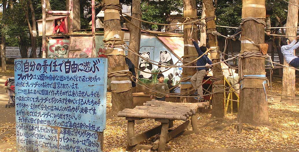 Japanese children playing unsupervised in city adventure play parks