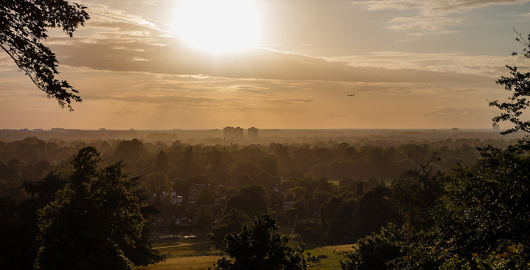 A view over London at sunset from Richmond Park, founded in 1634.
