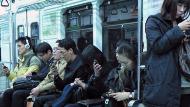 Much of our life in public space is now spent immersed in glowing screens. Photo: Marc Smith