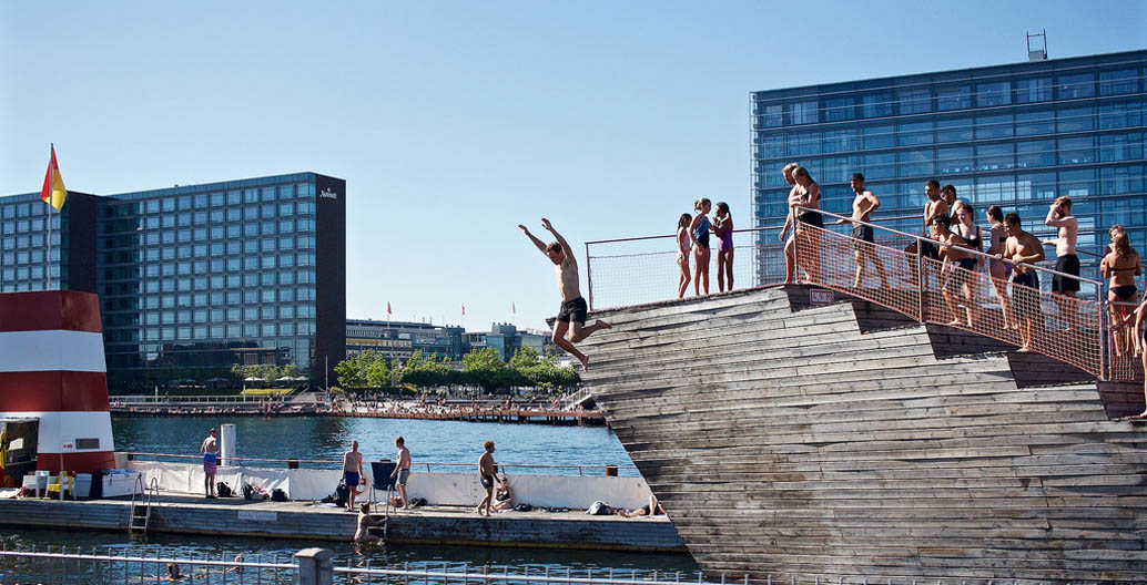 Copenhagen residents enjoy the Islands Brygge Harbour Bath, designed by BIG and JDS Architects.
