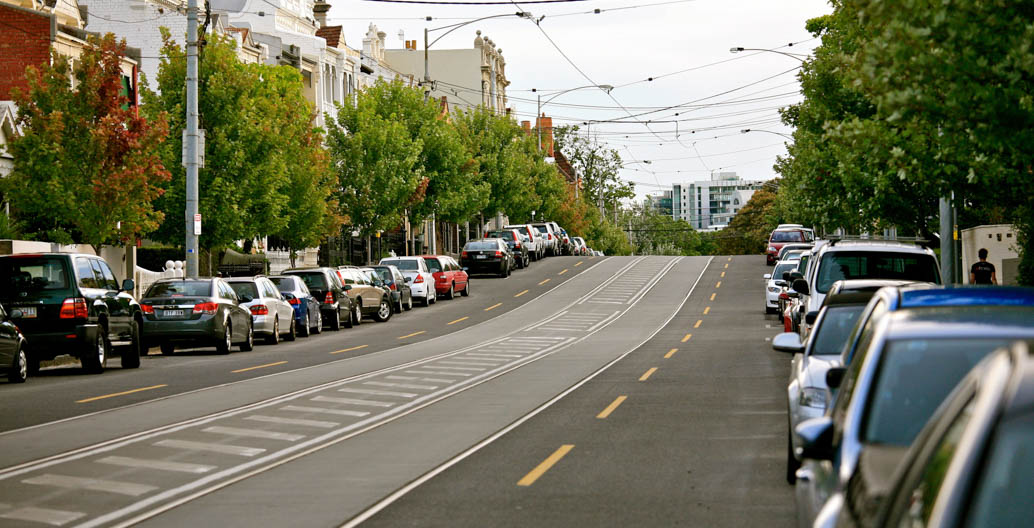In Melbourne's inner suburb of South Yarra, on-street car parking shares space with trams, pedestrians, cyclists, and moving traffic.