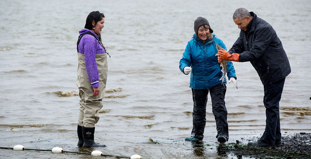 Barack Obama with salmon fisherwomen Kanakanak Beach in Bristol Bay, Alaska. Image: Obama White House Archives.