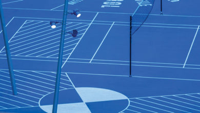 Customised bright blue WE-EF FLC141 LED projectors with glare shields were theatrically fixed to the angled poles to provide functional illumination for The Field