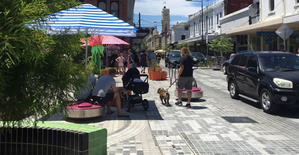 Pavement treatments signal a shift away from the car-centric street. Image: Rush Wright Associates