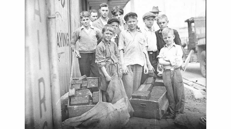 'Block boys' at St Peters, retrieving discarded wooden blocks Image: Sam Hood, courtesy State Library of NSW.