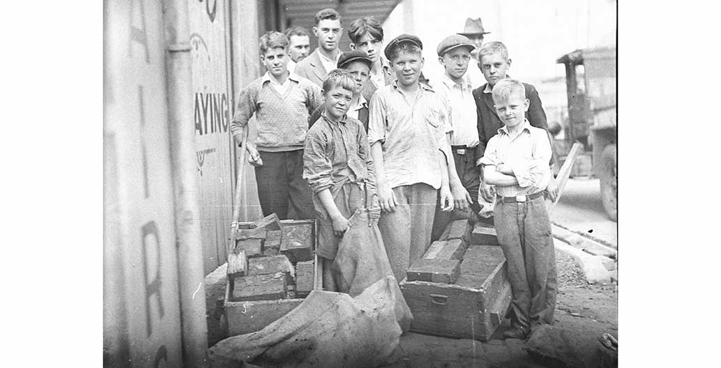 'Block boys' at St Peters, retrieving discarded wooden blocks Image: Sam Hood, courtesy State Library of NSW.