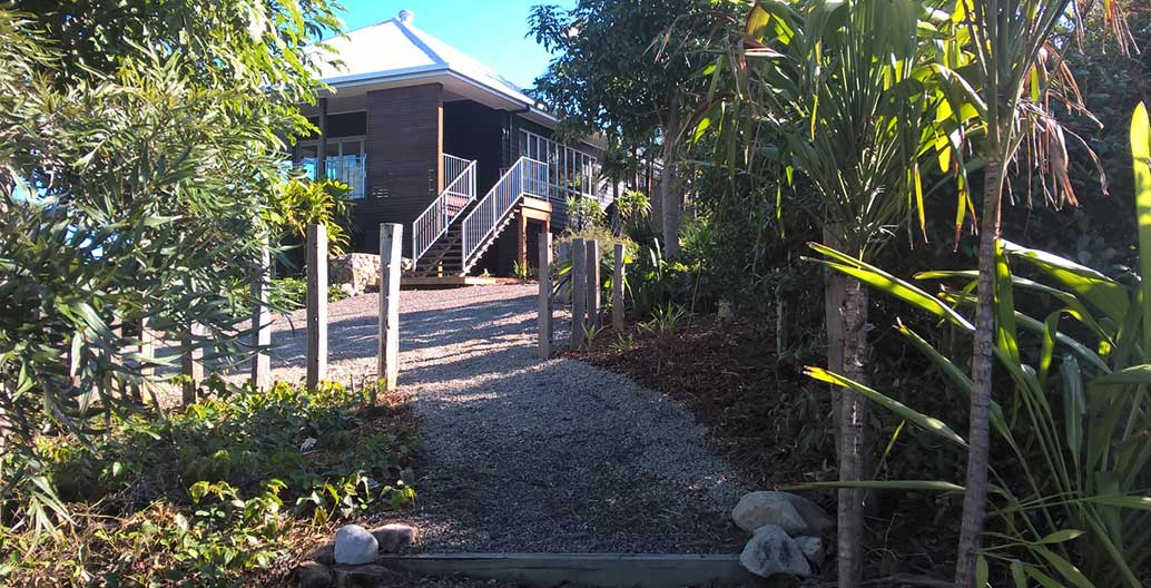 Reconfigured front stairs and landscaping