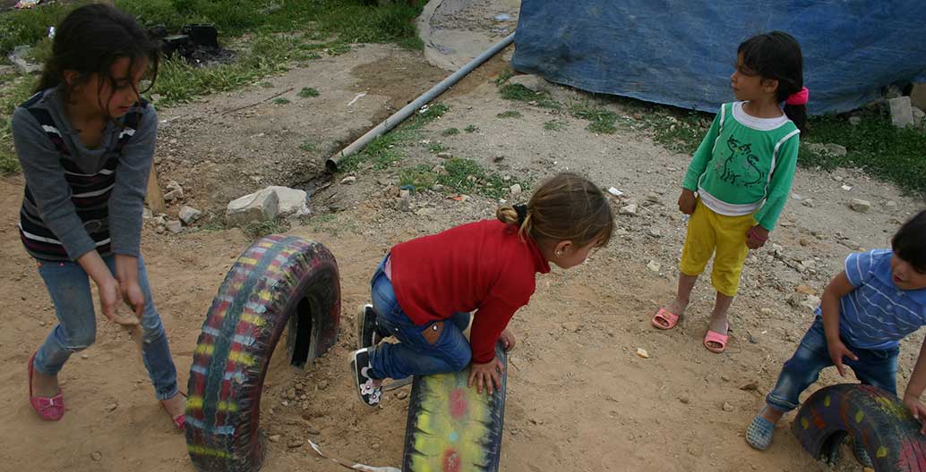 Children play in the new, improvised playground.