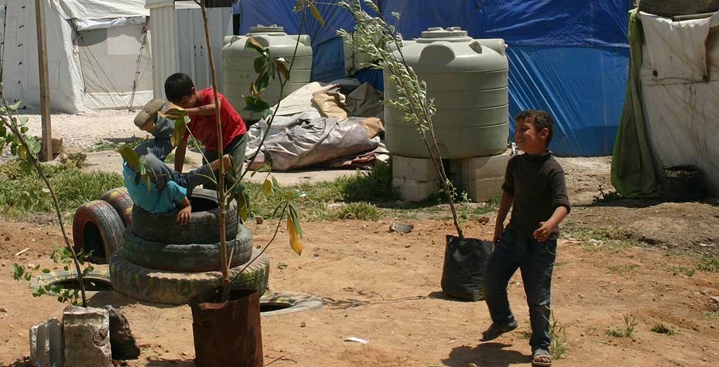 Children play in the new, improvised playground.