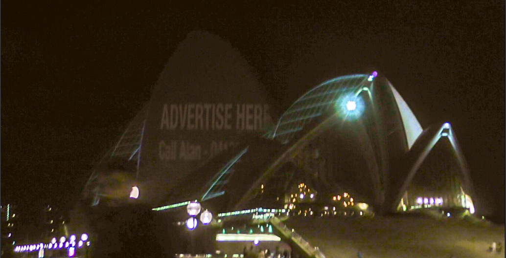 The Chaser projected "Advertise Here" on a number of Sydney institutions Image: The Chaser.
