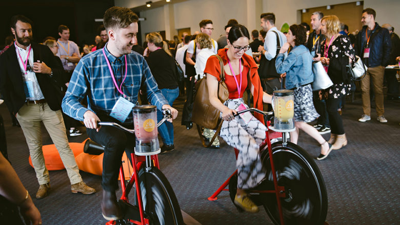 Conference delegates “biking” a smoothie at the WE-EF “Bike’n’Blend” station