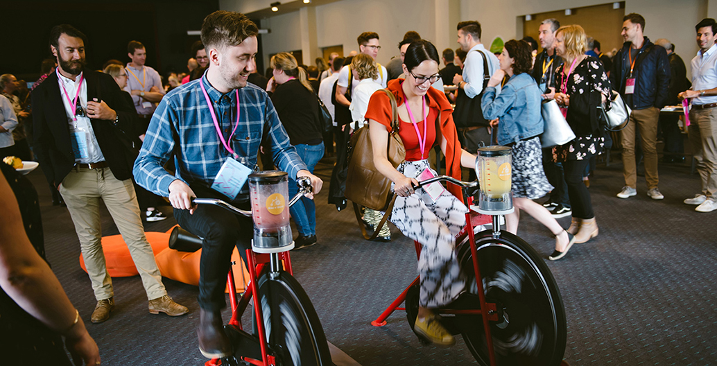 Conference delegates “biking” a smoothie at the WE-EF “Bike’n’Blend” station