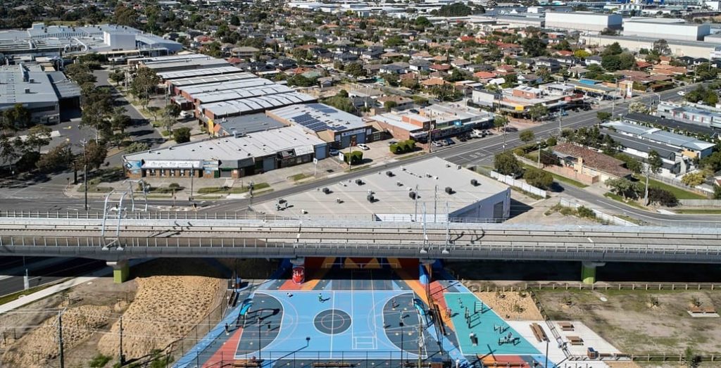 Elevated rail frees space for public parks and plazas in Melbourne's built-up suburbs.