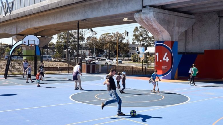 Local residents enjoy public recreation facilities designed by Aspect Studios enabled by elevated rail. Photo: Peter Bennetts Photography