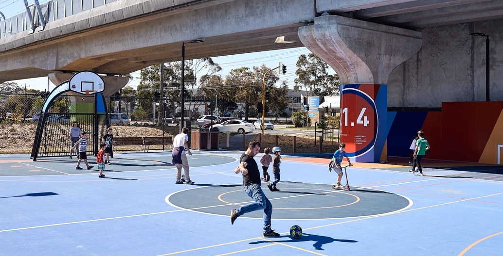 Local residents enjoy public recreation facilities designed by Aspect Studios enabled by elevated rail. Photo: Peter Bennetts Photography