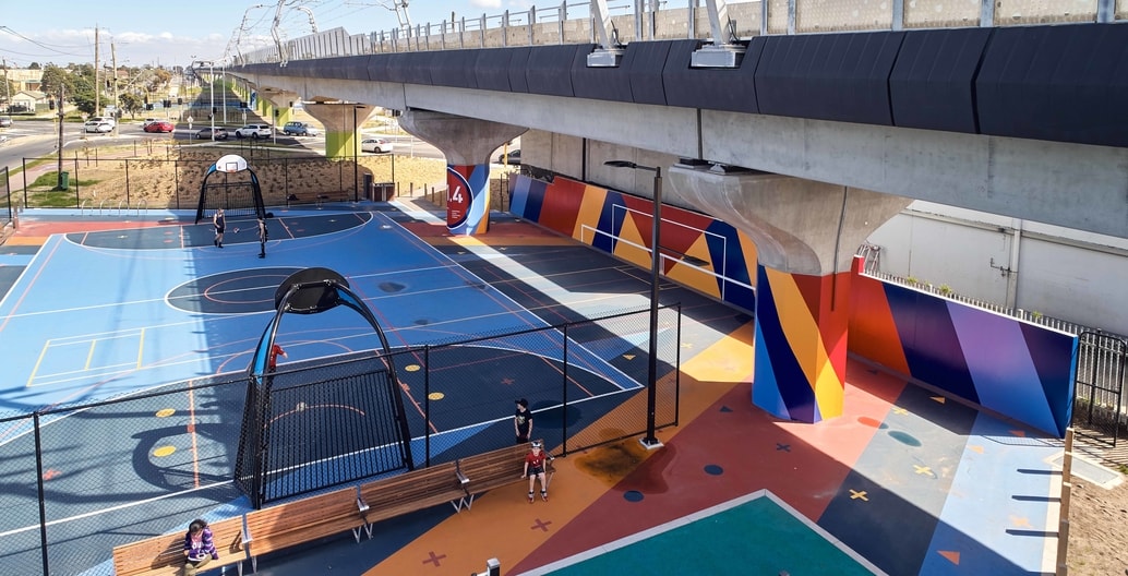 Strong colours and bold graphics identify the plazas of each sky rail precinct.