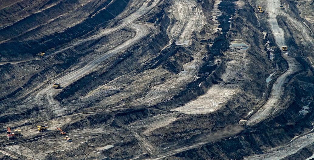 Vast open-cut mines characterise extraction processes today in Australia and globally.