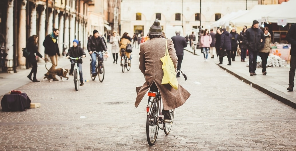 Many European city roads encourage walking and cycling and are often closed to private car traffic. Ferrara, Italy.