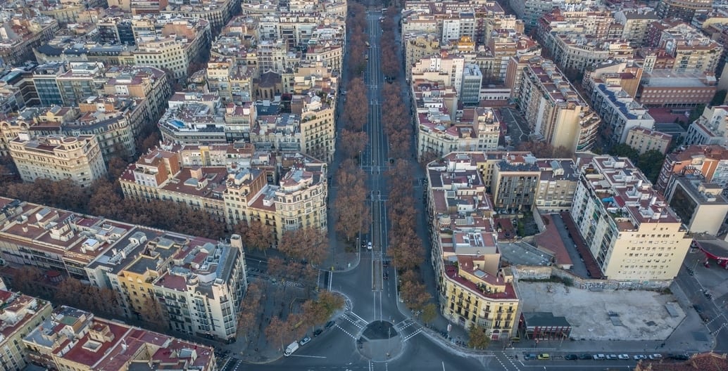 Typical of many generous European boulevards, Barcelona's dense urban street tree canopies moderate high summer temperatures.
