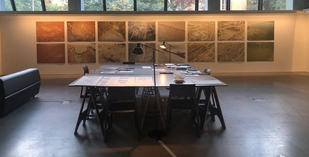 WaterLore research table and aerial photography wall.