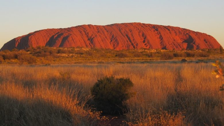 Uluru is an inselberg, literally "island mountain" dominantly composed of arkose, a coarse-grained type of sandstone. It has great cultural significance for the Aṉangu people. Photo: Melissa Nursey-Bray