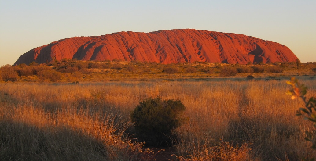 Uluru is an inselberg, literally "island mountain" dominantly composed of arkose, a coarse-grained type of sandstone. It has great cultural significance for the Aṉangu people. Photo: Melissa Nursey-Bray