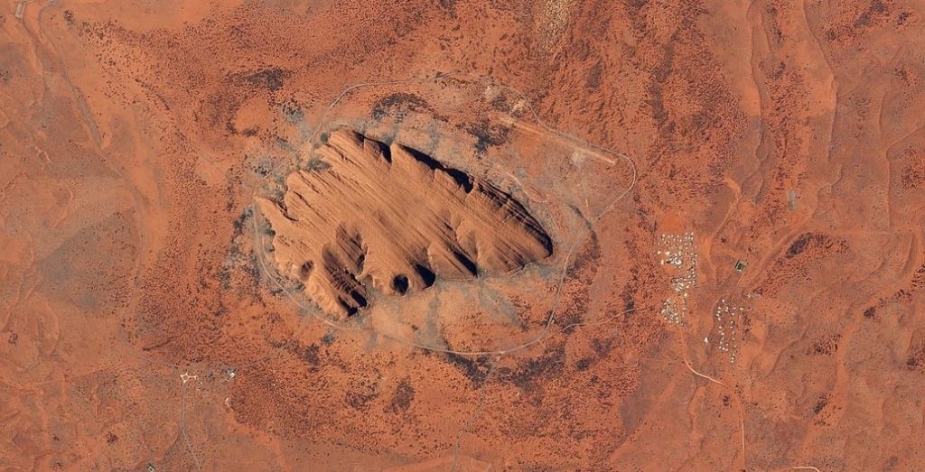 Uluru from above. It has a total circumference of 9.4km. Photo: Planet Lab