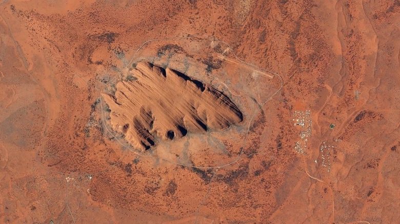 Uluru from above. It has a total circumference of 9.4km. Photo: Planet Lab