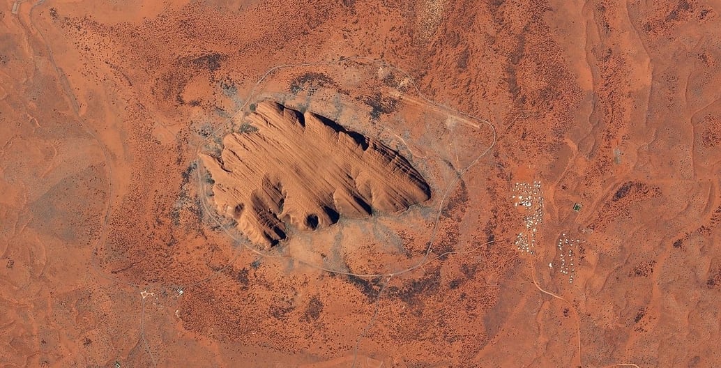 Uluru from above. It has a total circumference of 9.4km. Photo: Planet Lab