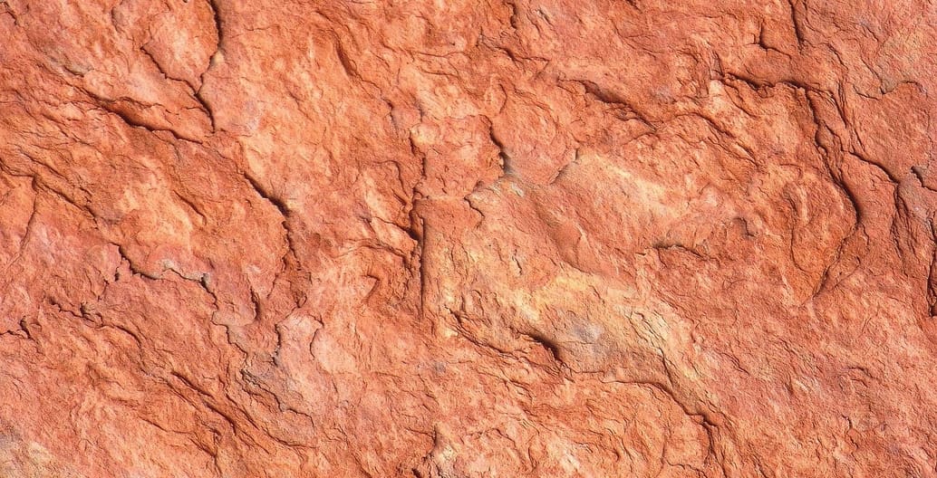 Increased hot weather, drought, fire and flash floods will erode the rock, also accelerating a honeycomb effect that will literally change the face of Uluru. Photo: Peter Jones