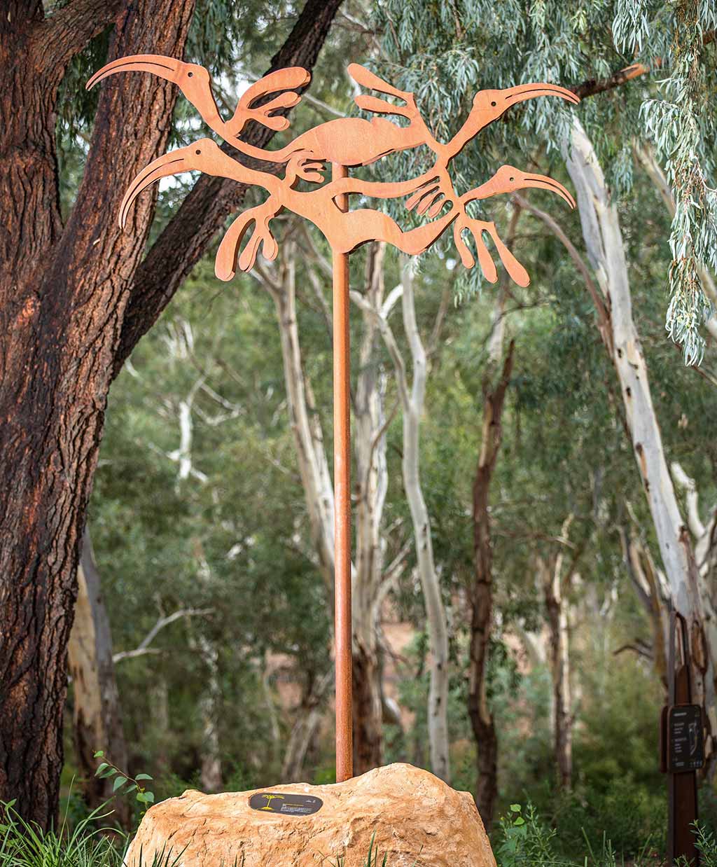 One of five cultural markers designed by Paul Herzich along the trail in Felixstowe reserve. It depicts glossy ibis bird, known in the Kaurna language as Tjilbruke. Photo: Same River