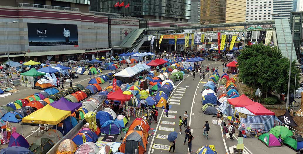 The encampment of the student group Occupy Central with Love and Peace in Admiralty, Hong Kong, September 2014. Students defended themselves with umbrellas that evening when flooded with tear gas. Photo: Wing1990hk