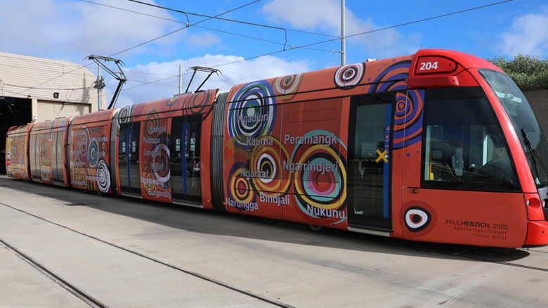 Adelaide to Glenelg tram wrap designed by the Kaurna/Ngarrindjeri landscape architect and visual artist. Image: Department of Transport and Infrastructure, SA.