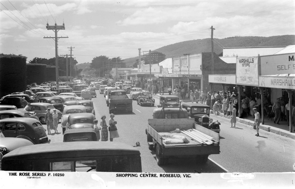 Shoppers enjoying the ample, loosely regulated parking of Rosebud, c.1940. Image: Rose Stereograph Co. (SLV collection)