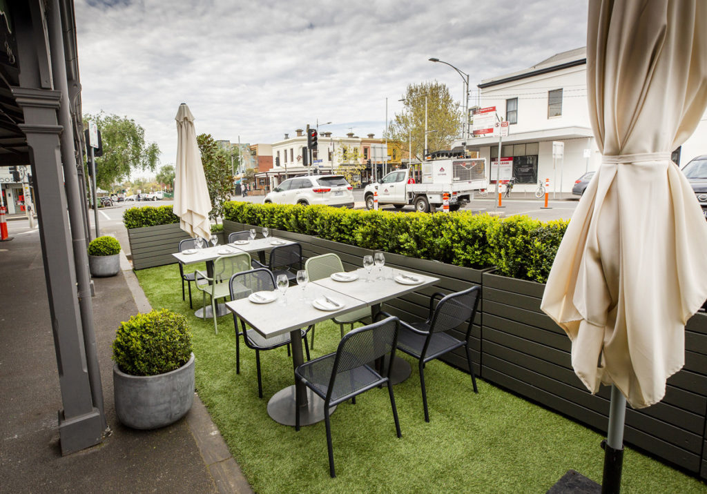 Outdoor car parking spaces outside of King & Godfree, Carlton, have been transformed into an outdoor dining area. Image: courtesy of City of Melbourne