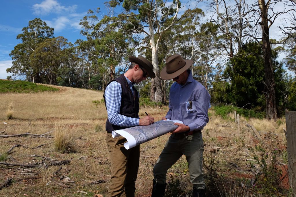 Thomas Woltz (left) and Paul Appleton (right) planning an agricultural property on site in northern Tasmania. Photo: Courtesy Paul Appleton