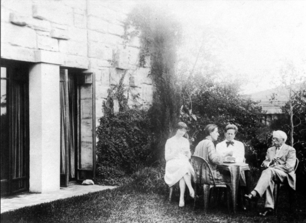 Marion and Walter with architect Louise Lightfoot (left) from the Griffins’ office and Walter’s father George, who was visiting from the USA, sitting outside the Griffins' home. Photograph Rowland Herbert, late 1920s, courtesy Walter Burley Griffin Society.